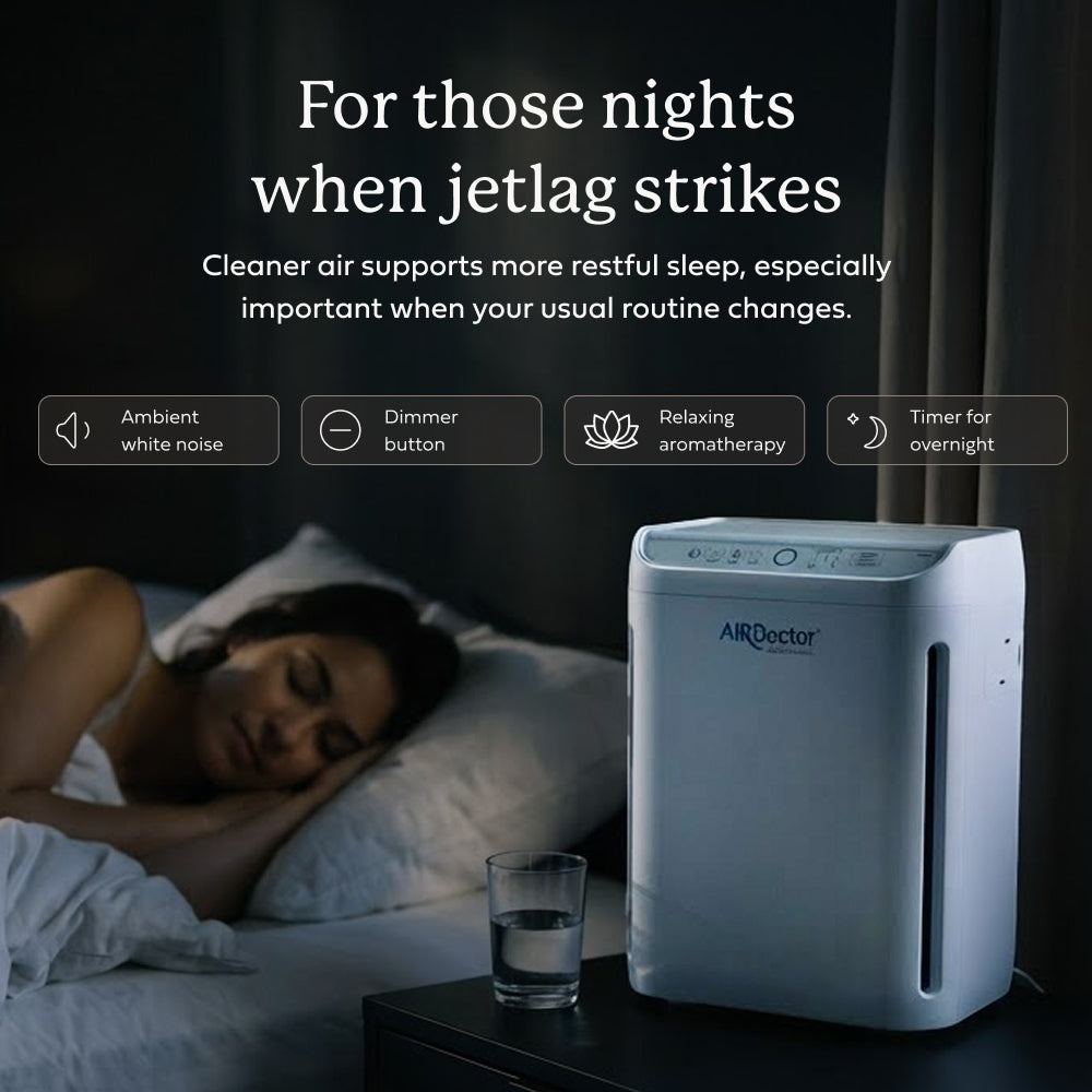 AirDoctor GO! on a bedroom nightstand next to a sleeping woman