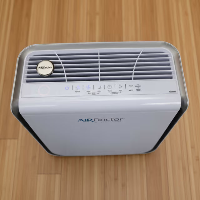 AromaTru diffuser clip on an airdoctor air purifier
